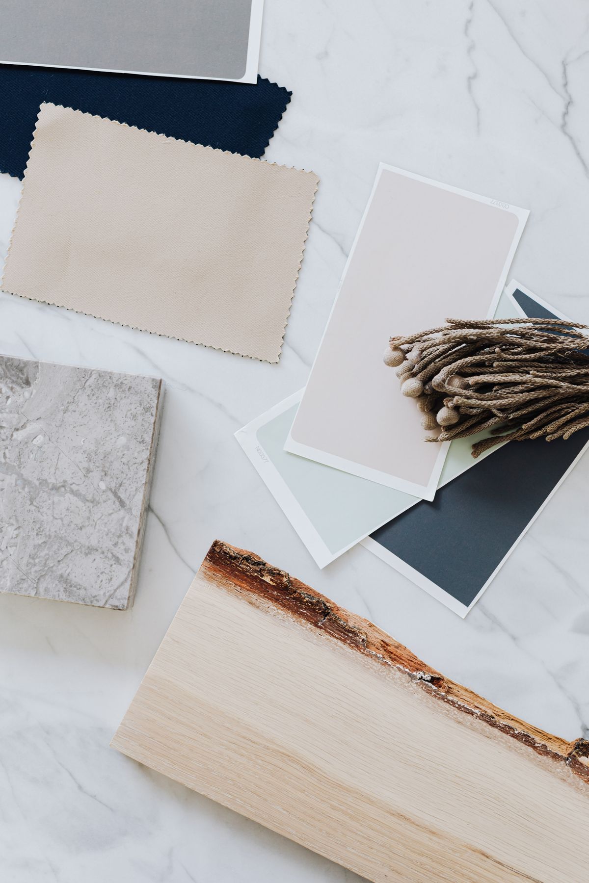 Wood, stone, lacquer, and color material samples for custom furniture